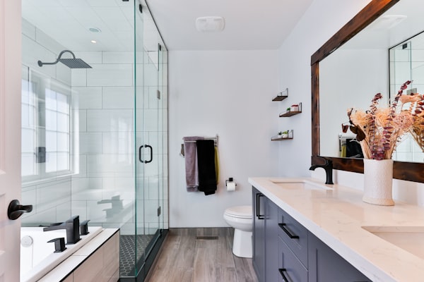 Modern bathroom renovation with walk-in shower and floor-to-ceiling tiling in Clonmel